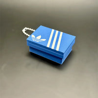 Llavero clicker caja de zapatillas azul