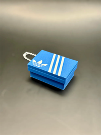 Llavero clicker caja de zapatillas azul